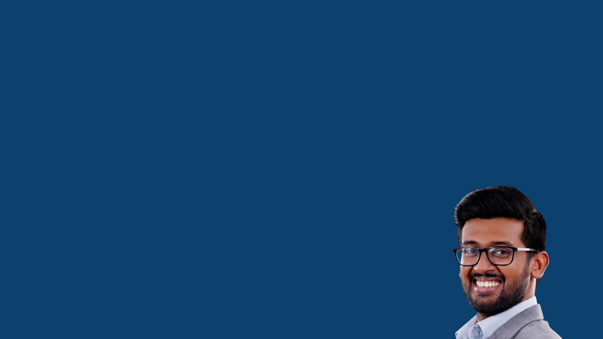 Headshot of Heshitha Paranavithana in suit on blue background